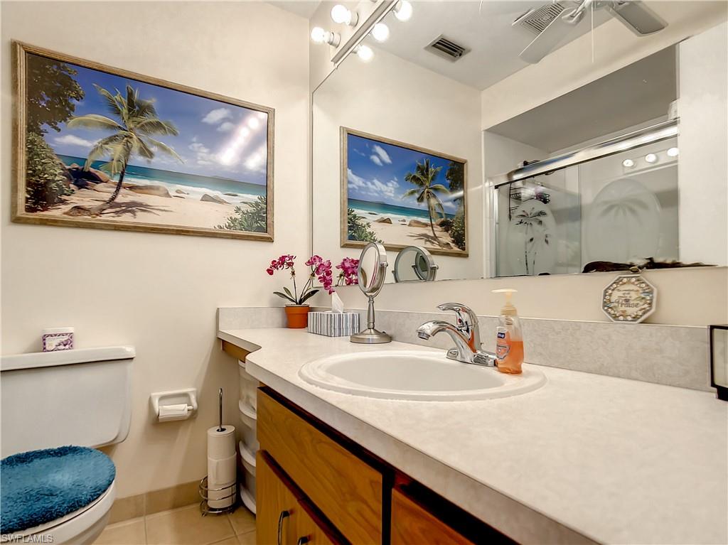 9072 Hamlin Road West Fort Myers, FL 33967 - Photo 21 of 50 a bathroom with a sink mirror and toilet