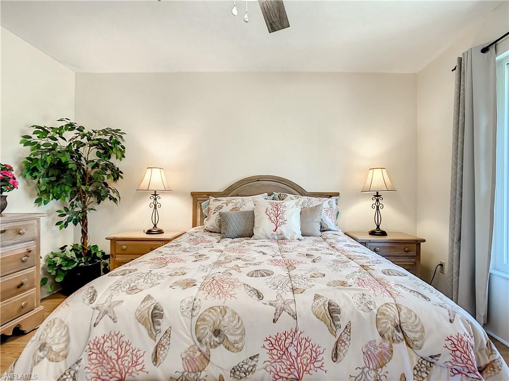 9072 Hamlin Road West Fort Myers, FL 33967 - Photo 23 of 50 a bedroom with a bed and a potted plant