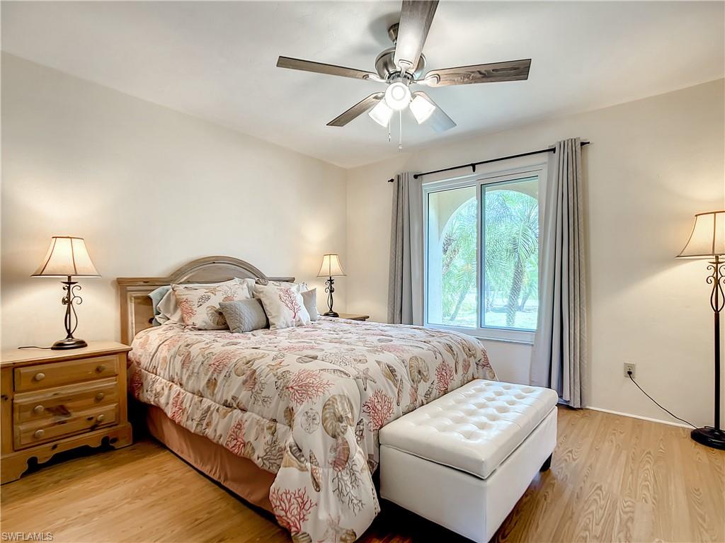 9072 Hamlin Road West Fort Myers, FL 33967 - Photo 25 of 50 a bedroom with a bed and a couch