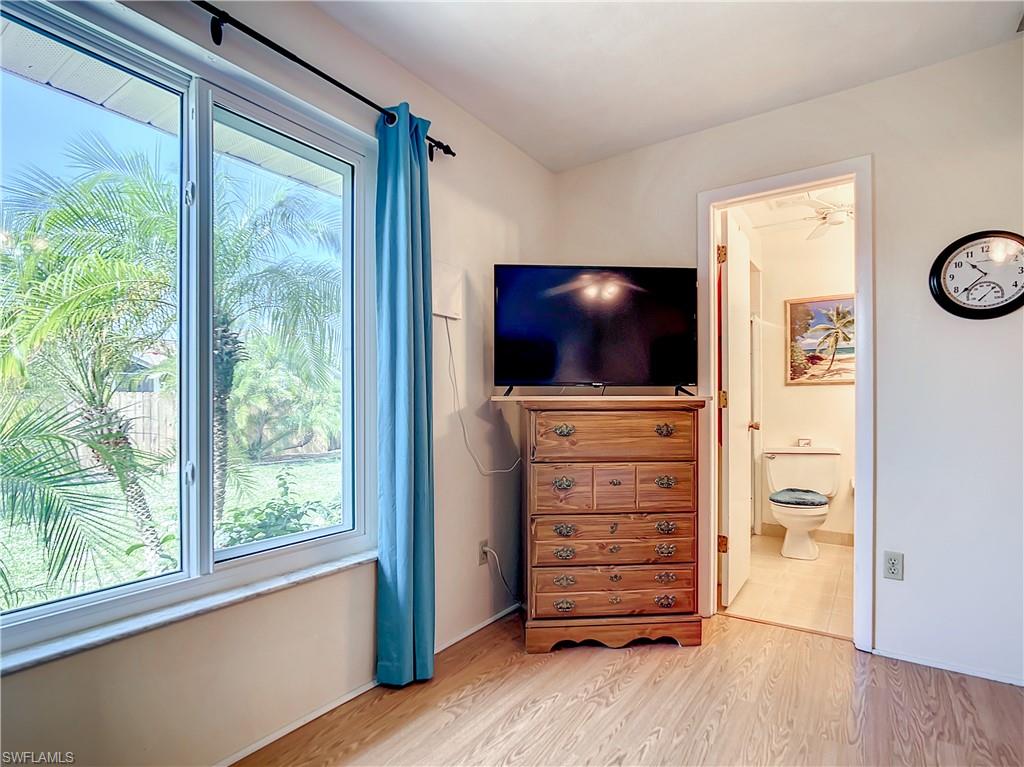 9072 Hamlin Road West Fort Myers, FL 33967 - Photo 28 of 50 an empty room with furniture and flat screen tv