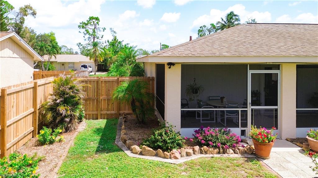 9072 Hamlin Road West Fort Myers, FL 33967 - Photo 38 of 50 a view of a house with a flower garden