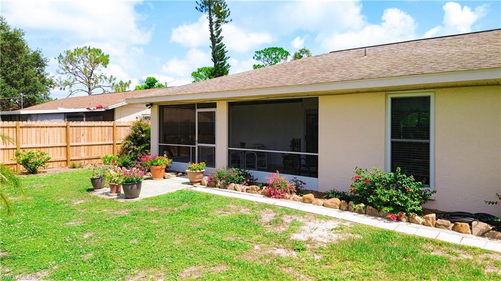 9072 Hamlin Road West Fort Myers, FL 33967 - Photo 39 of 50 a front view of a house with garden