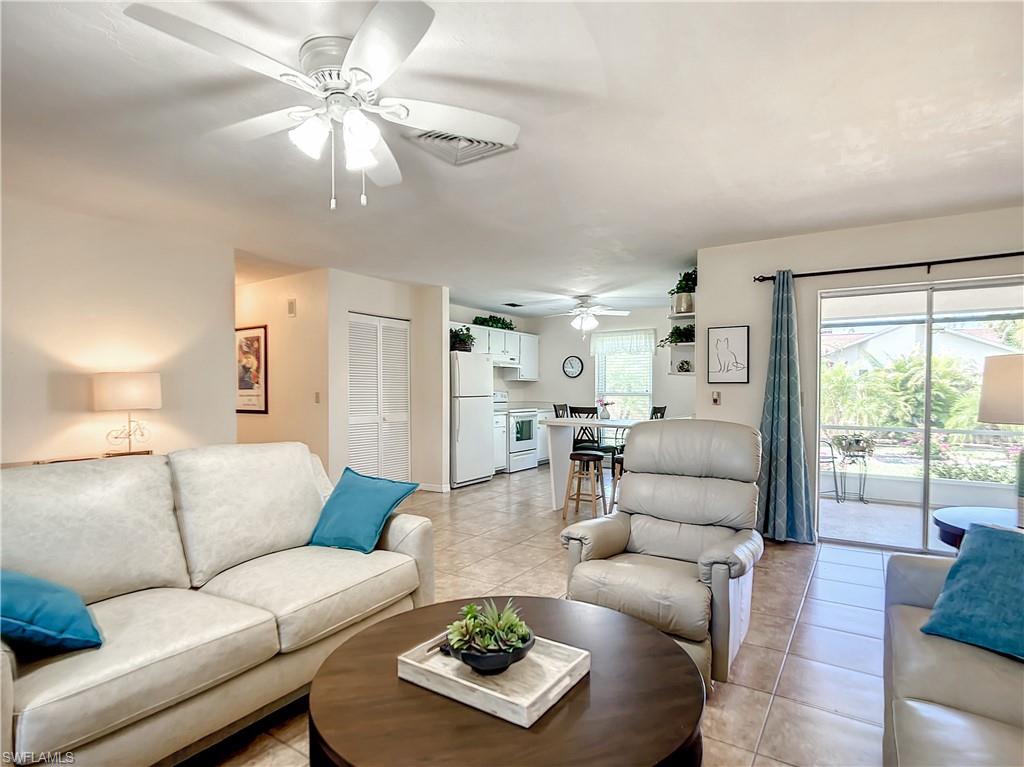 9072 Hamlin Road West Fort Myers, FL 33967 - Photo 4 of 50 a living room with furniture ceiling fan and a window