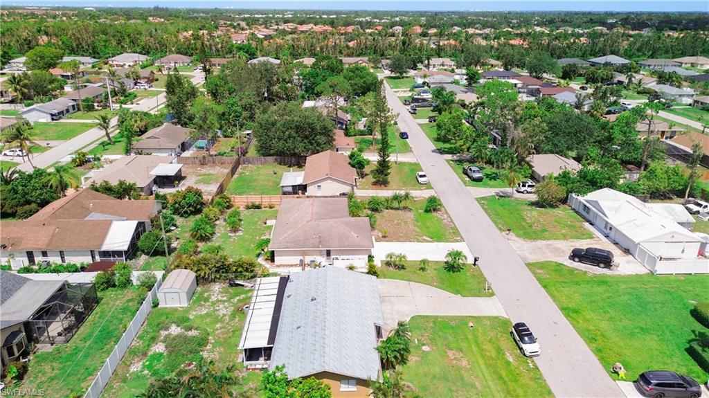 9072 Hamlin Road West Fort Myers, FL 33967 - Photo 42 of 50 an aerial view of multiple houses with yard