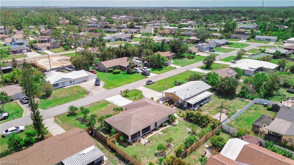 9072 Hamlin Road West Fort Myers, FL 33967 - Photo 44 of 50 an aerial view of multiple houses with yard