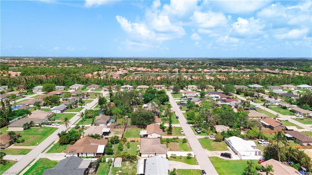 9072 Hamlin Road West Fort Myers, FL 33967 - Photo 48 of 50 an aerial view of residential houses with outdoor space