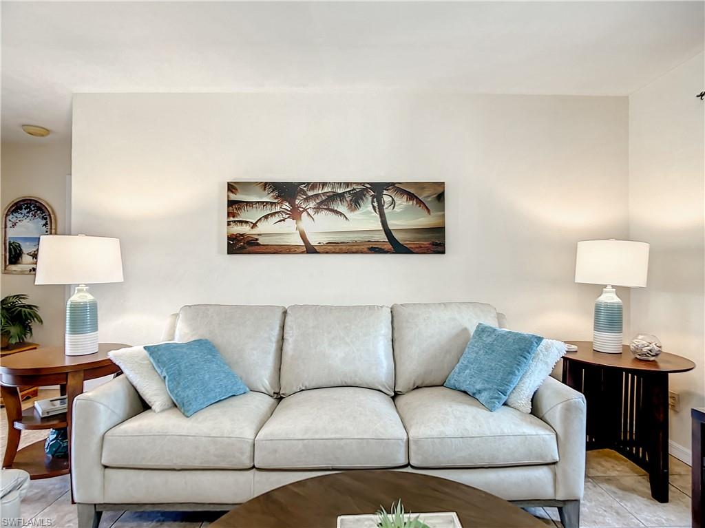 9072 Hamlin Road West Fort Myers, FL 33967 - Photo 5 of 50 a living room with furniture and a lamp