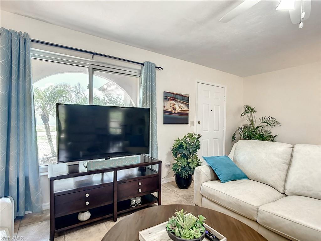 9072 Hamlin Road West Fort Myers, FL 33967 - Photo 7 of 50 a living room with furniture and a flat screen tv