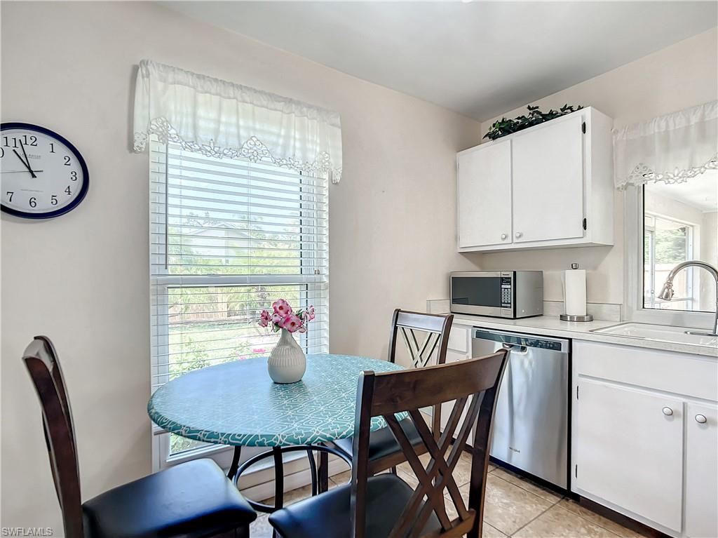 9072 Hamlin Road West Fort Myers, FL 33967 - Photo 9 of 50 a view of a dining room with furniture window and wooden floor