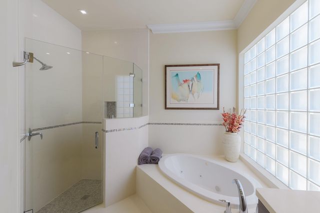 a bedroom with furniture and wooden floor