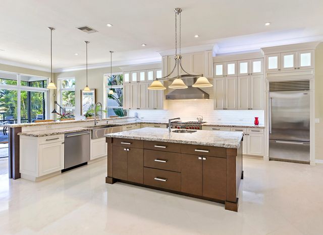 a kitchen with a sink stove and cabinets
