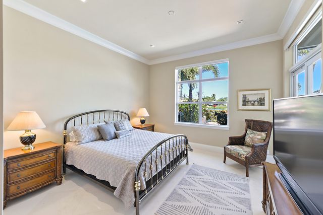 a bathroom with a tub double sink and mirror