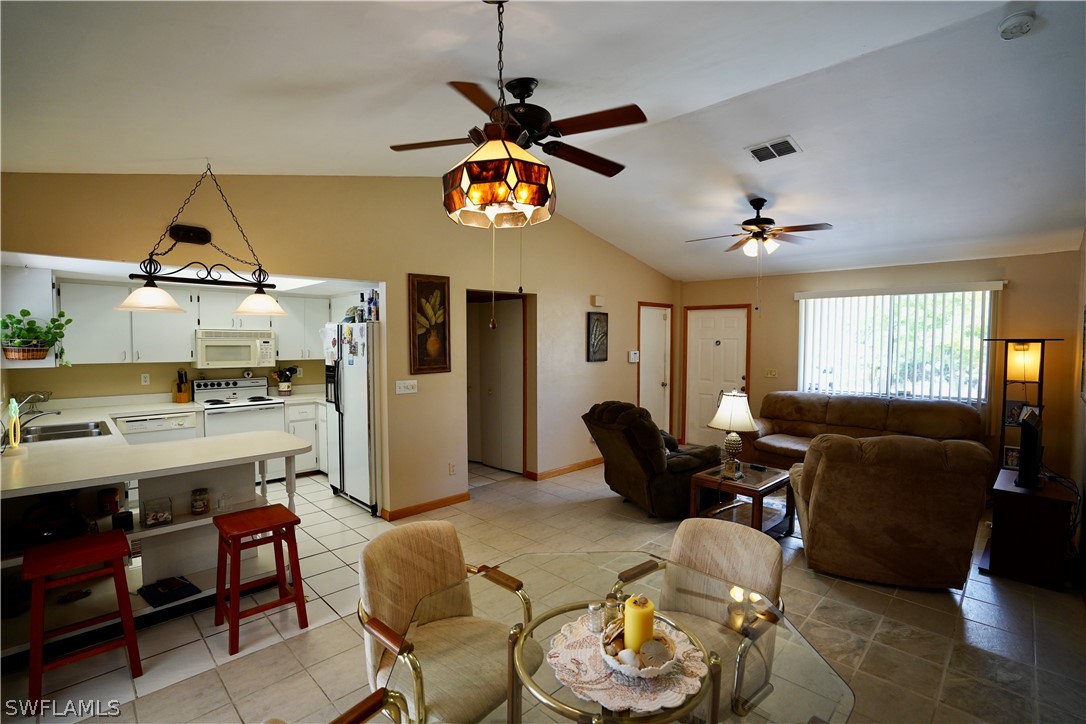8036 Anhinga Road Fort Myers, FL 33967 - Photo 5 of 28 a living room with furniture kitchen view and a window