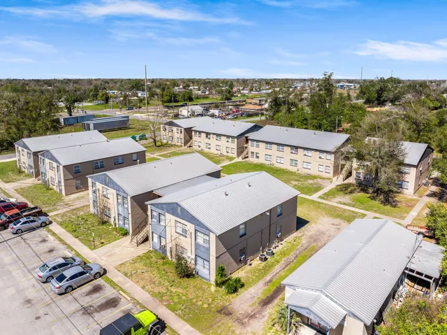 a view of a balcony with an outdoor seating