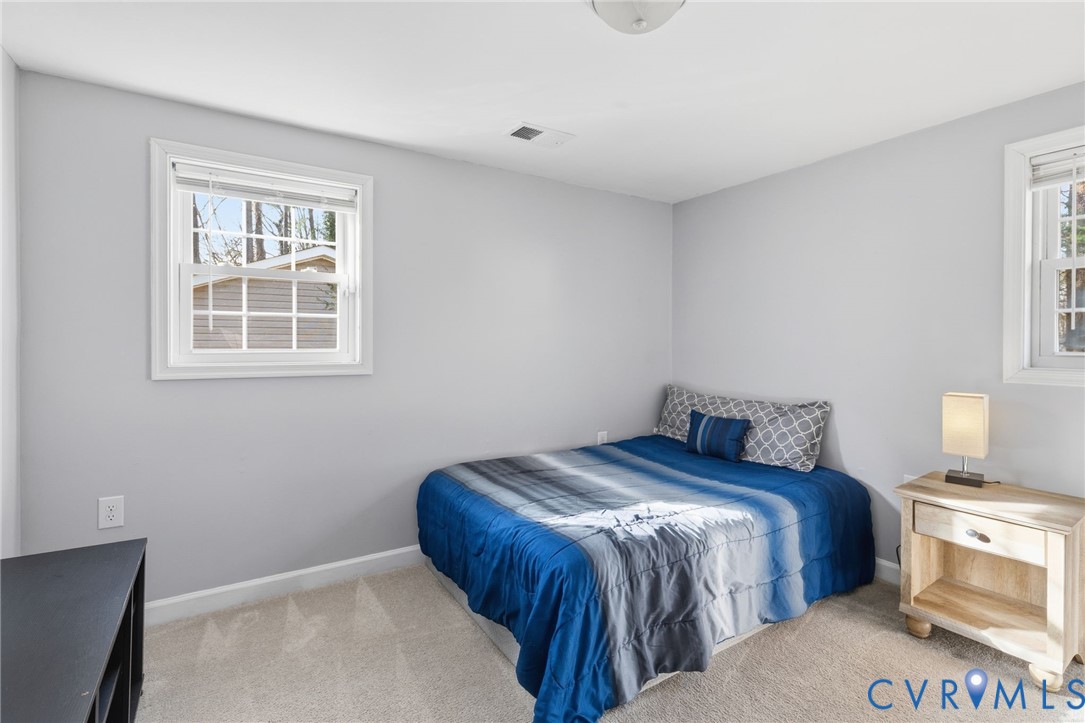 12145 White Bark Road Ruther Glen, VA 22546 - Photo 14 of 23 a bedroom with a bed and a window