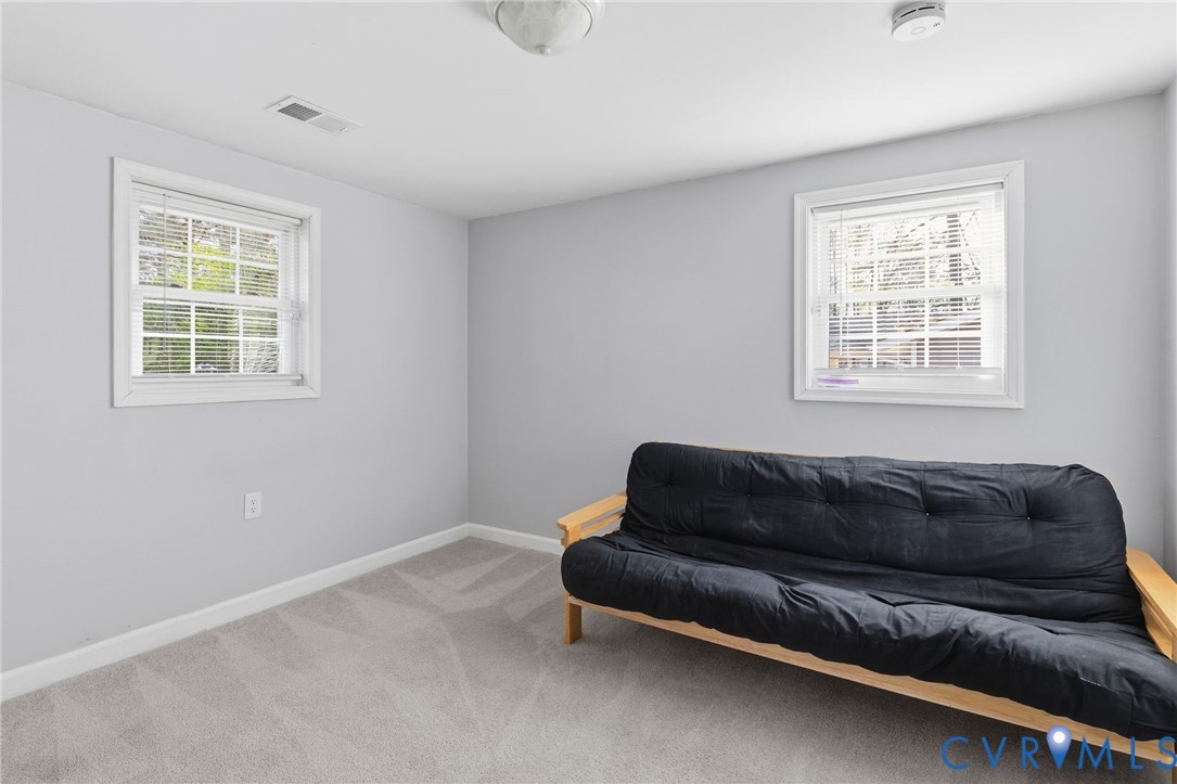 12145 White Bark Road Ruther Glen, VA 22546 - Photo 15 of 23 a living room with a couch and a window