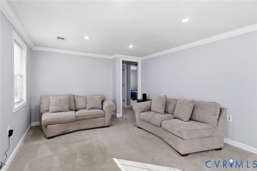 12145 White Bark Road Ruther Glen, VA 22546 - Photo 4 of 23 a living room with furniture and a couch