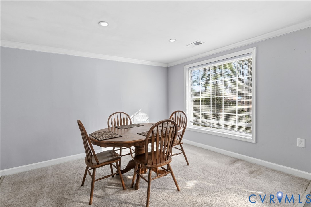 12145 White Bark Road Ruther Glen, VA 22546 - Photo 6 of 23 a view of a dining room with furniture and a window