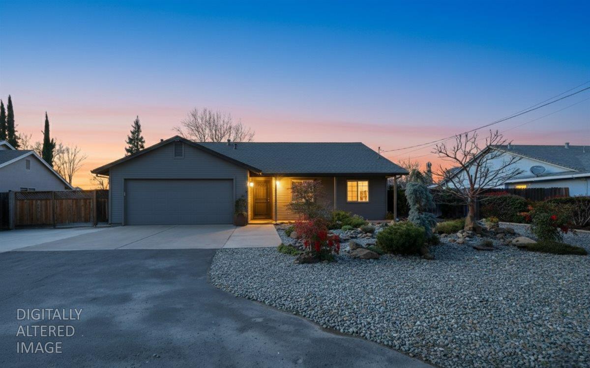 a view of a house with a yard and plants