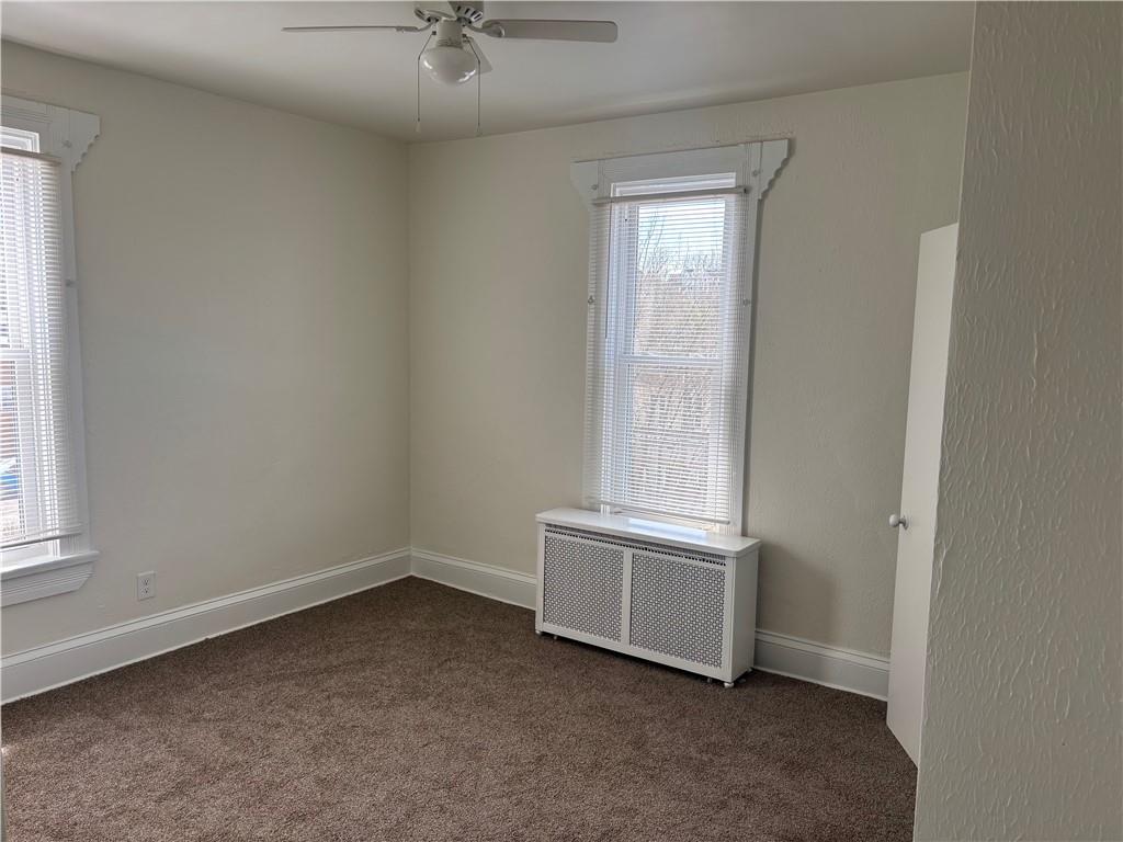 16 Oak Street Manor, PA 15665 - Photo 14 of 18 an empty room with windows and closet