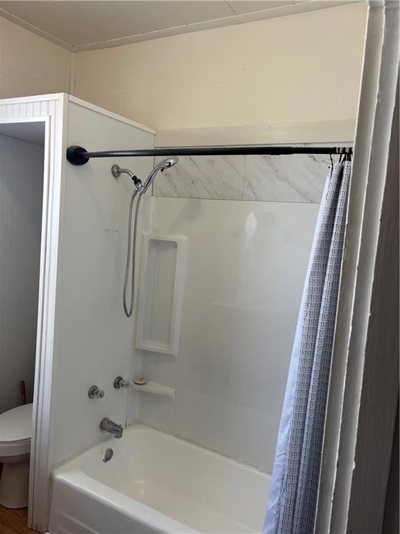 16 Oak Street Manor, PA 15665 - Photo 7 of 18 a bathroom with a bathtub and a shower