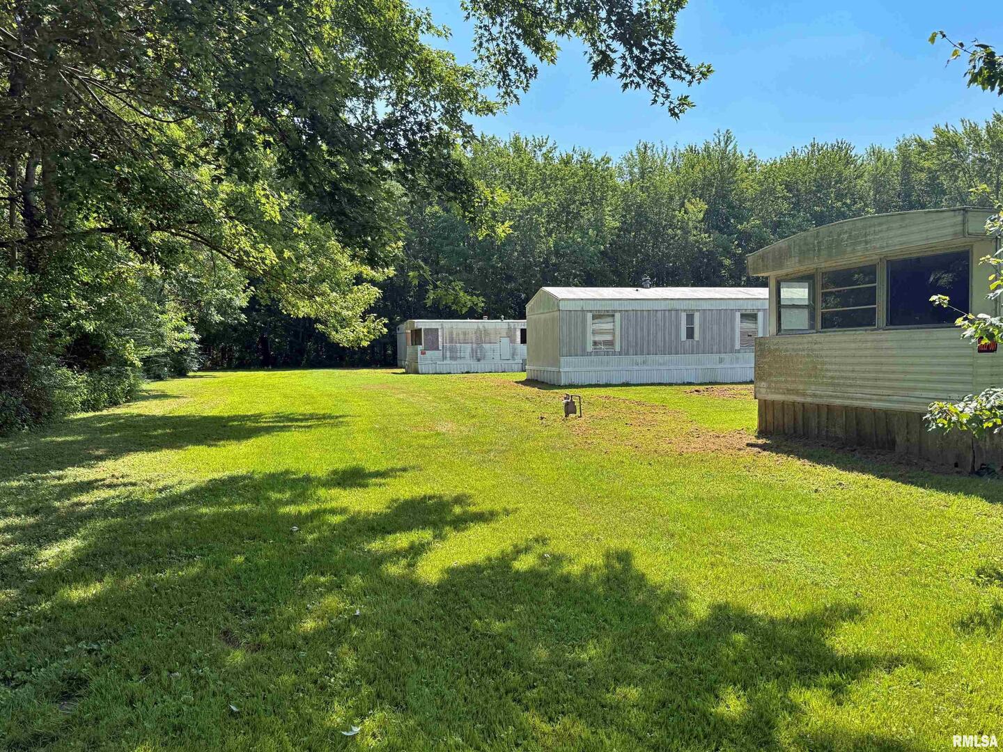 798 Airport Road Metropolis, IL 62960 - Photo 13 of 19 a view of a house with a yard