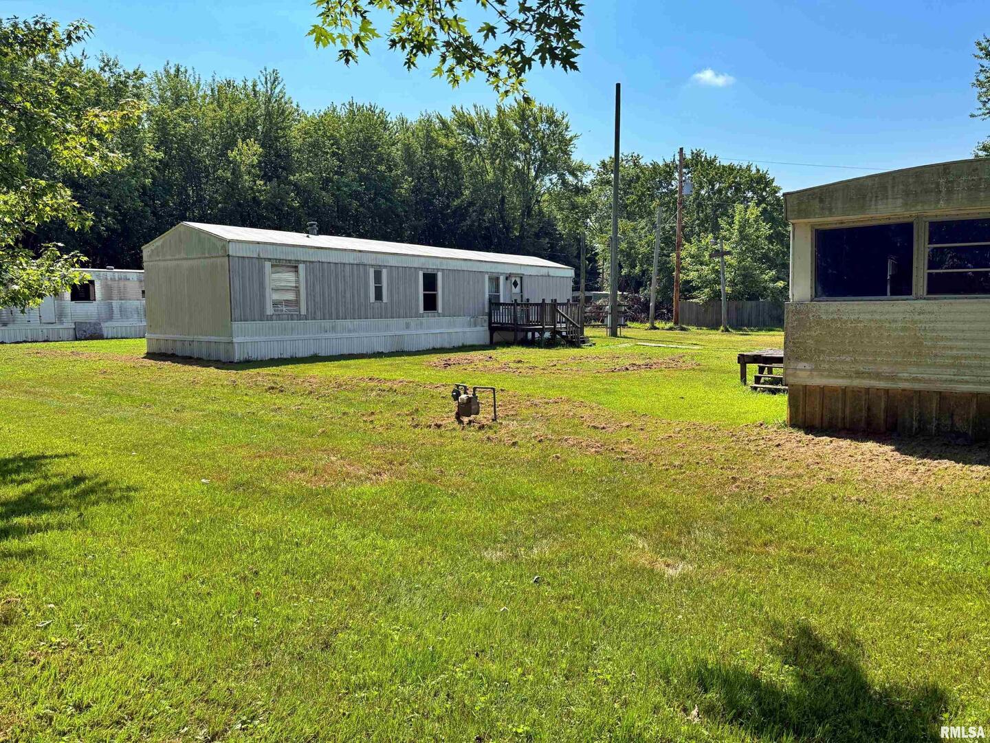 798 Airport Road Metropolis, IL 62960 - Photo 16 of 19 a front view of a house with a yard