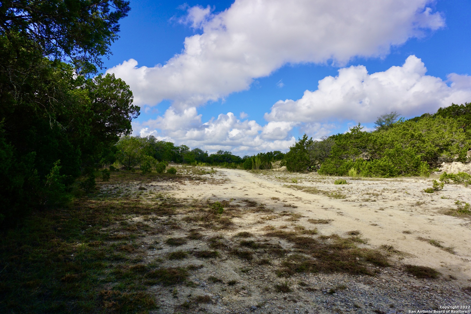 127 Leaders Hill Road Wimberley, TX 78676 - Photo 18 of 43 a view of a lake with a yard