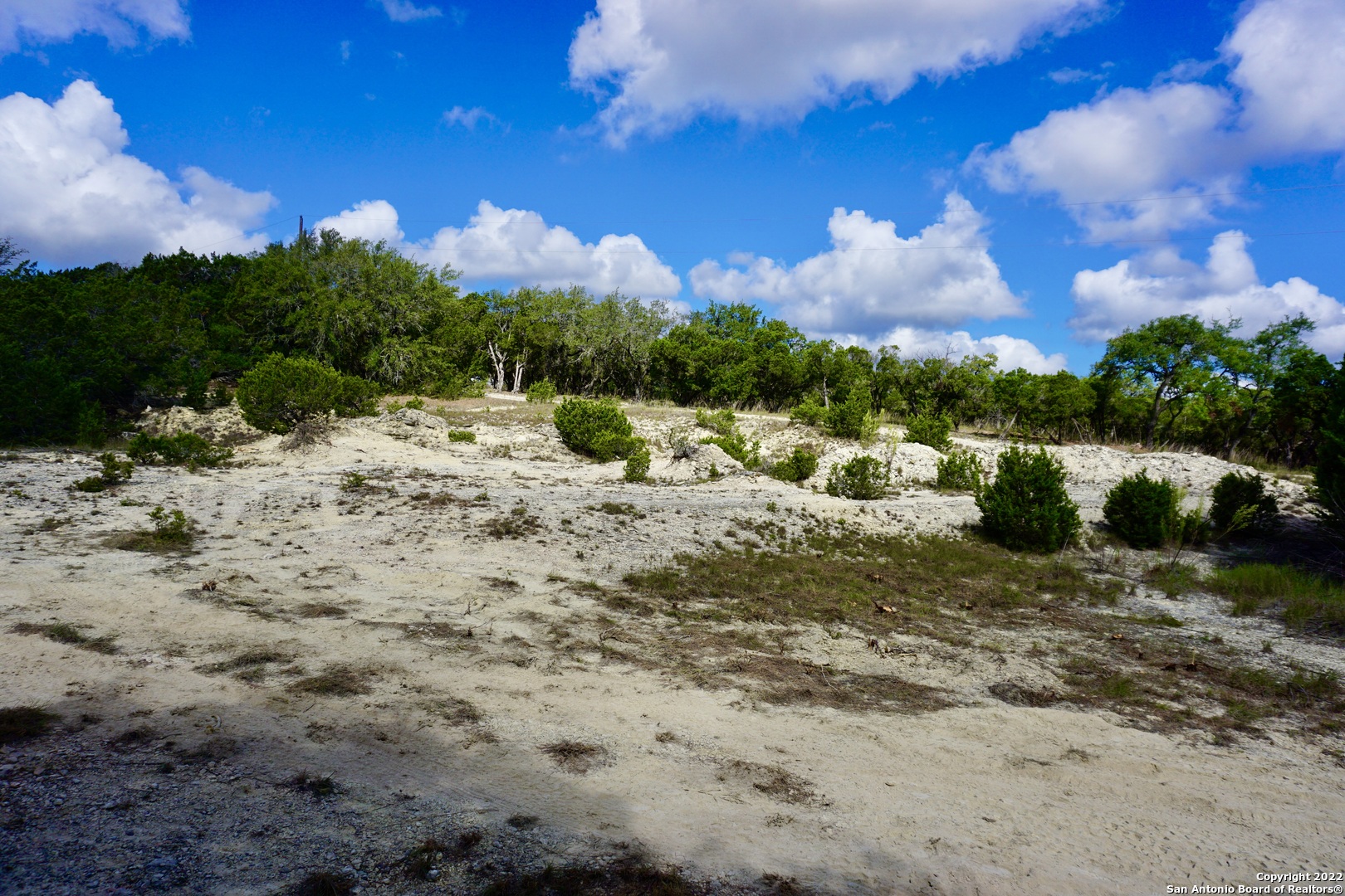 127 Leaders Hill Road Wimberley, TX 78676 - Photo 20 of 43 a view of a lake with a mountain