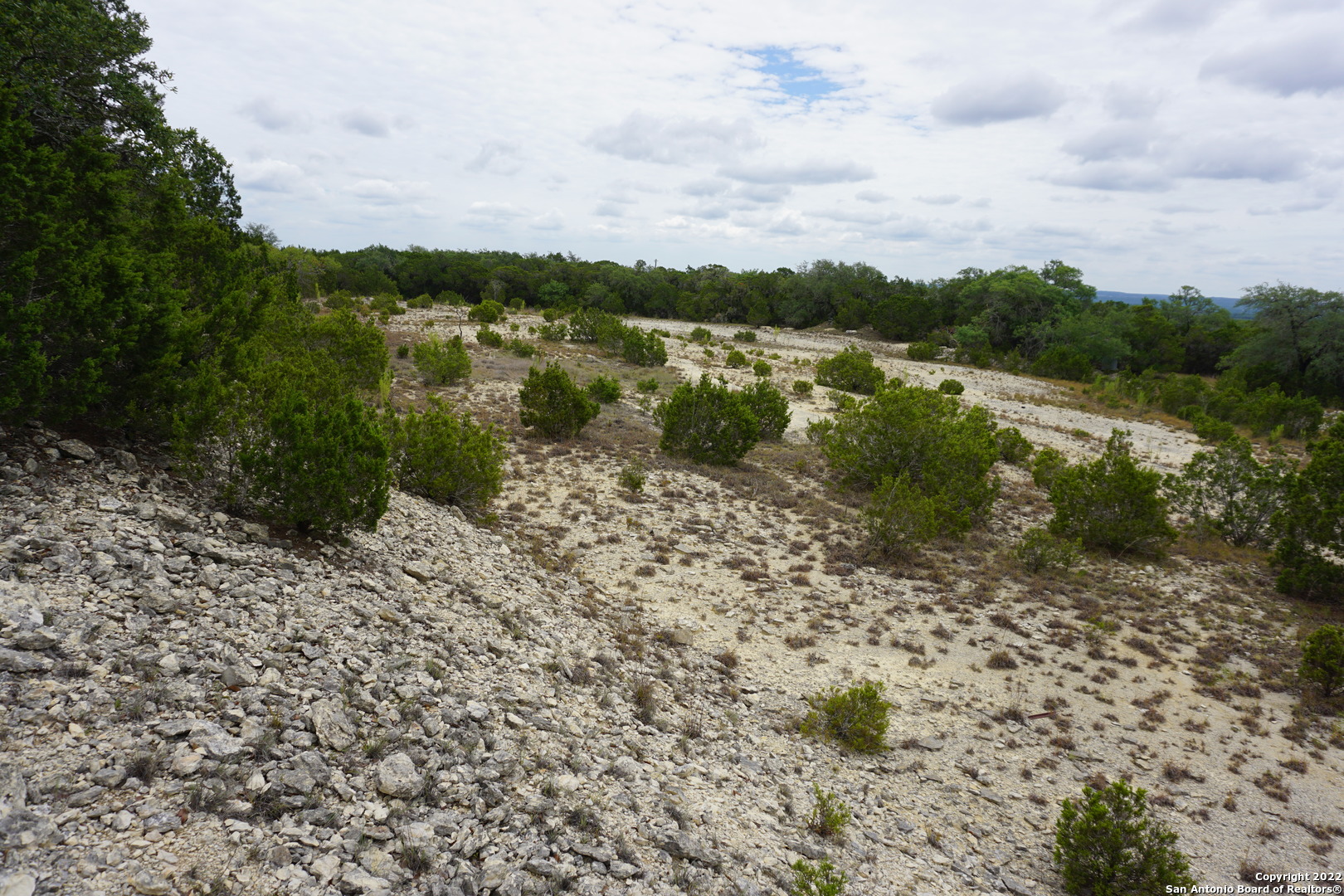 127 Leaders Hill Road Wimberley, TX 78676 - Photo 25 of 43 a view of a lake with houses in back