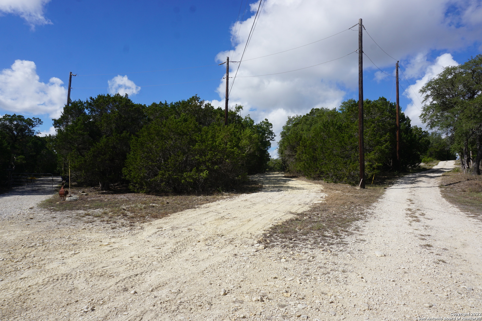 127 Leaders Hill Road Wimberley, TX 78676 - Photo 7 of 43 a view of a road with a building in the background