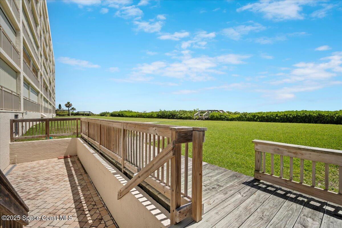 3221 South Atlantic Avenue, Unit 703 Cocoa Beach, FL 32931 - Photo 58 of 77 a view of a balcony with wooden floor