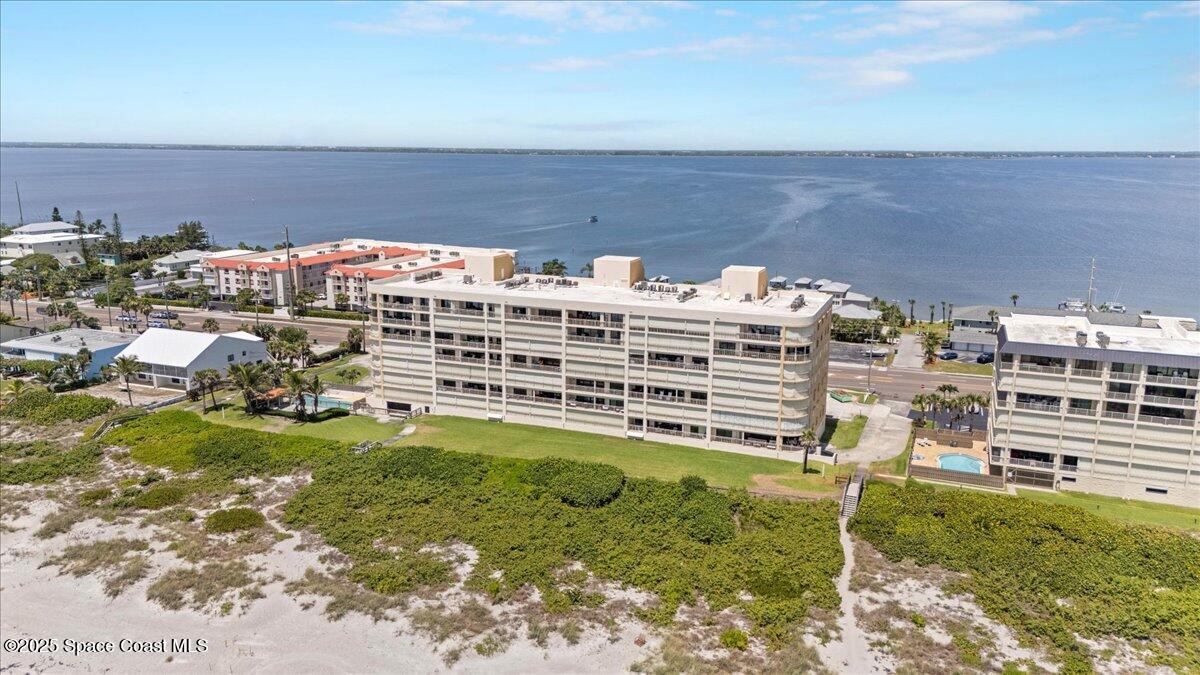 3221 South Atlantic Avenue, Unit 703 Cocoa Beach, FL 32931 - Photo 68 of 77 a view of a yard with an outdoor seating