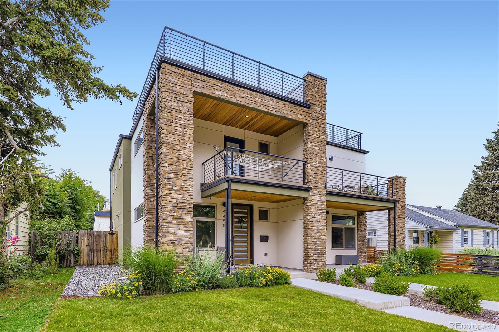 4455 Tejon Street Denver, CO 80211 - Photo 2 of 28 front view of house with a yard