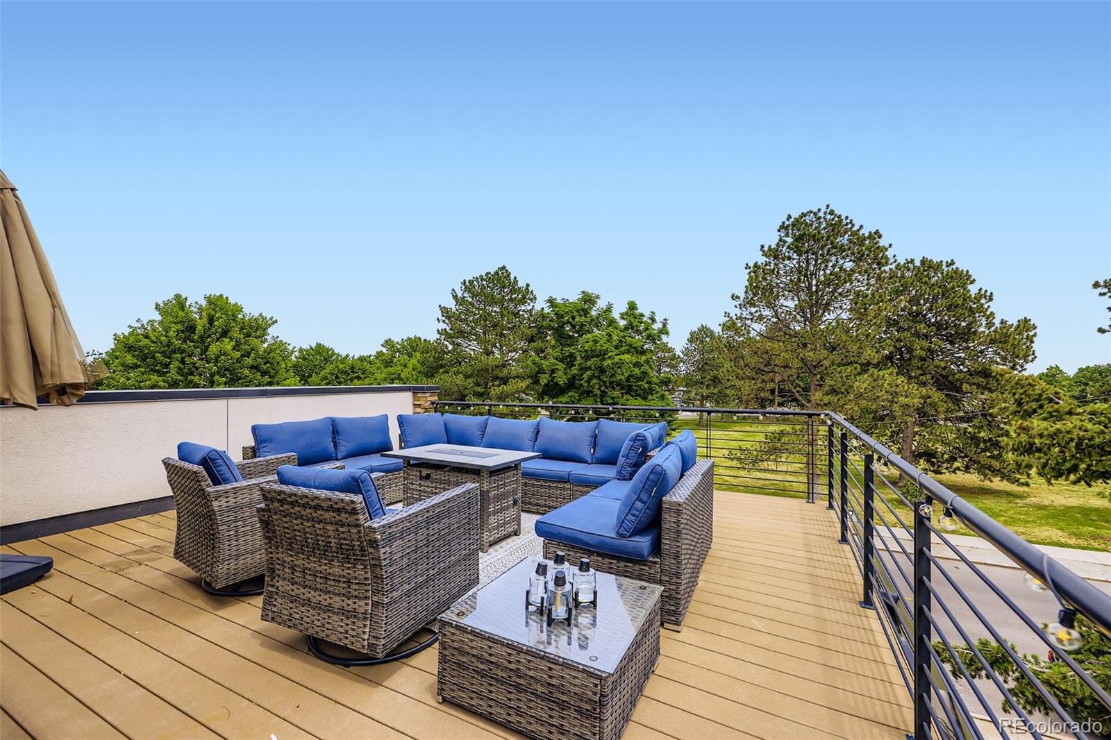 4455 Tejon Street Denver, CO 80211 - Photo 23 of 28 a view of roof deck with couches and wooden floor
