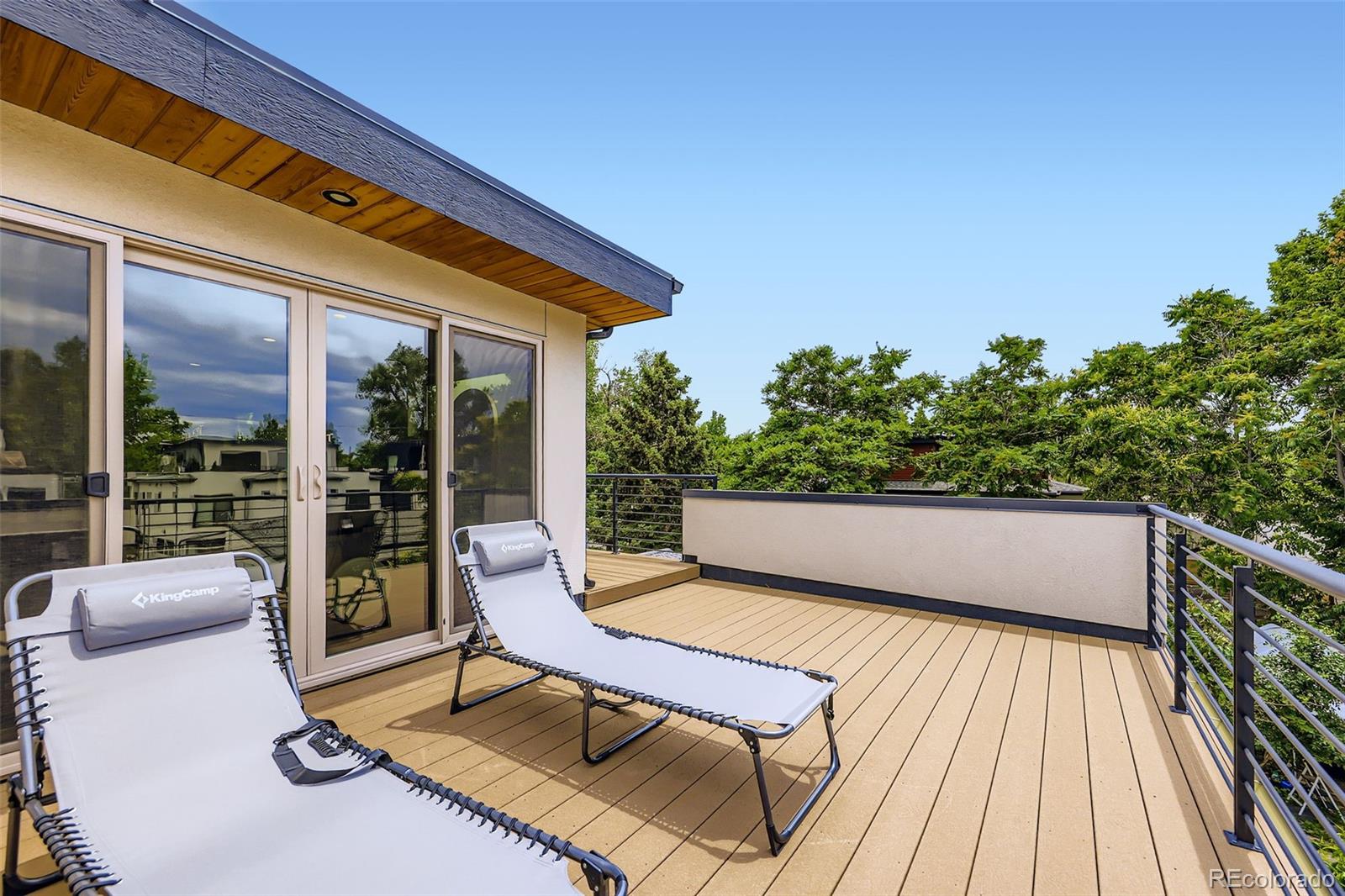 4455 Tejon Street Denver, CO 80211 - Photo 24 of 28 a balcony with furniture and a potted plant