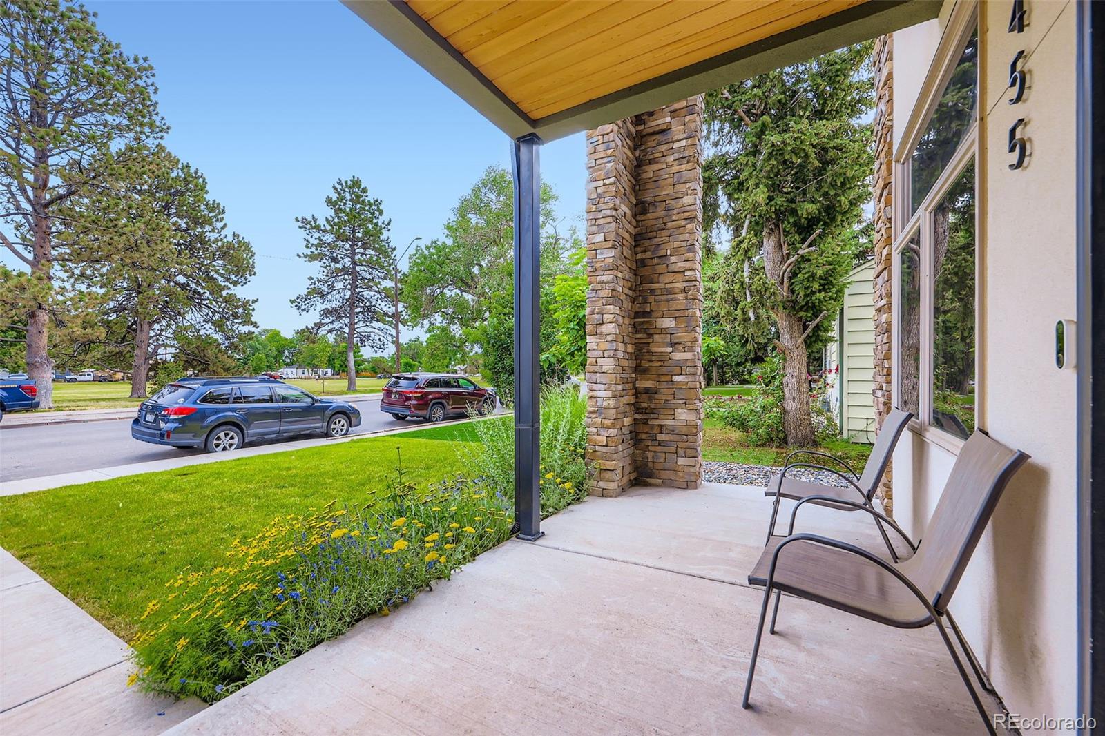 4455 Tejon Street Denver, CO 80211 - Photo 4 of 28 a view of a chair and tables in the back yard of the house