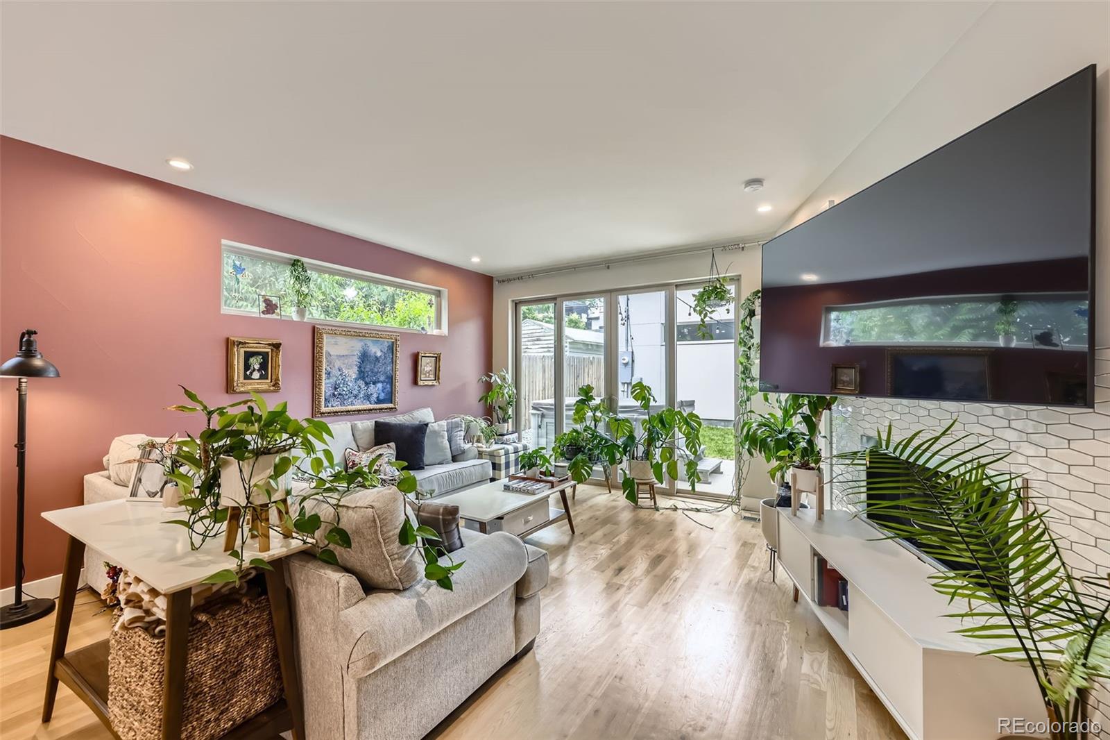 4455 Tejon Street Denver, CO 80211 - Photo 5 of 28 a living room with furniture floor to ceiling window and wooden floor