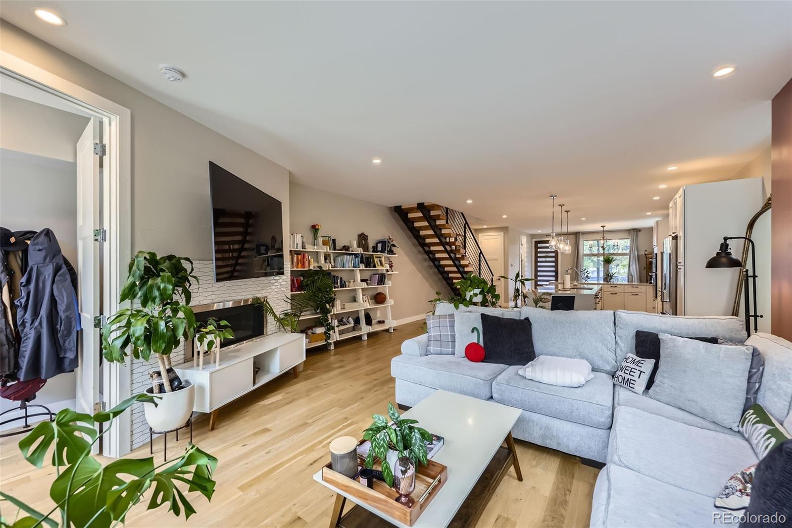 4455 Tejon Street Denver, CO 80211 - Photo 6 of 28 a living room with furniture and a flat screen tv