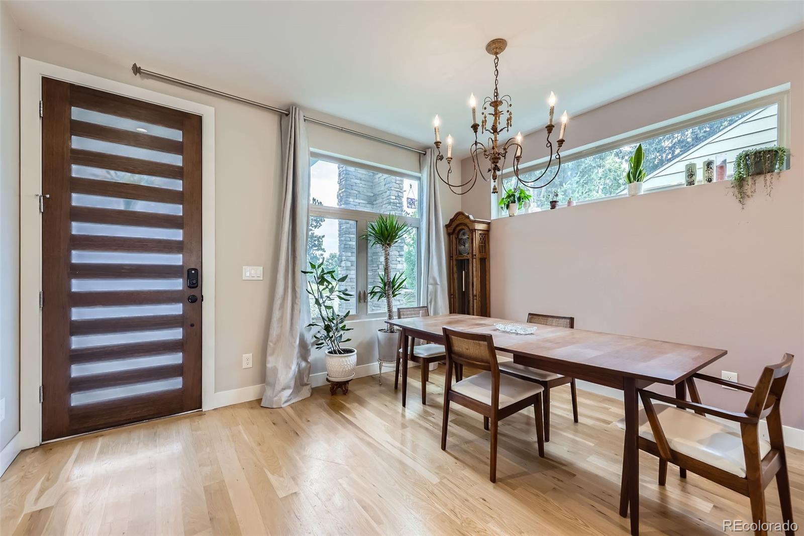 4455 Tejon Street Denver, CO 80211 - Photo 7 of 28 a view of a dining room with furniture window and wooden floor