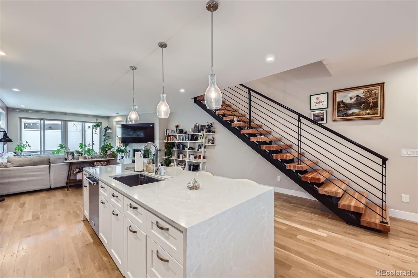 4455 Tejon Street Denver, CO 80211 - Photo 10 of 28 a kitchen with sink and center island