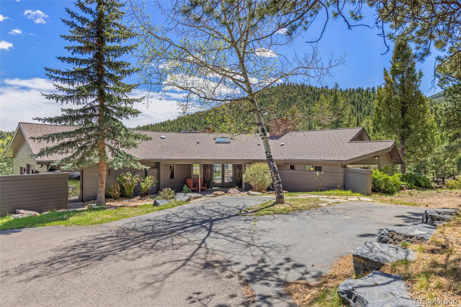 1323 South Snyder Gulch Road Evergreen, CO 80439 - Photo 47 of 47 a view of a house with a yard