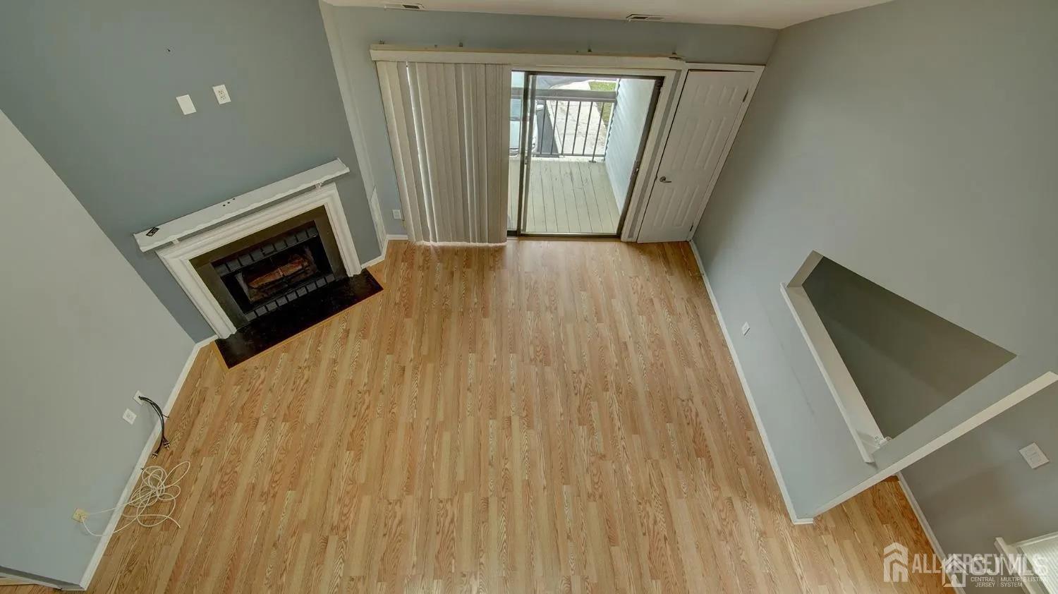 3003 Lighthouse Lane Parlin, NJ 08859 - Photo 14 of 25 a view of an empty room with wooden floor and a window