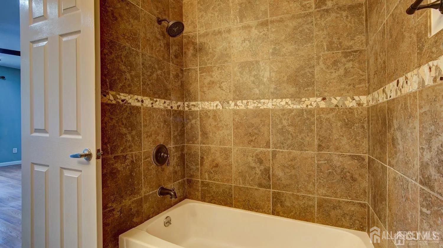 3003 Lighthouse Lane Parlin, NJ 08859 - Photo 18 of 25 a bathroom with a bathtub and shower