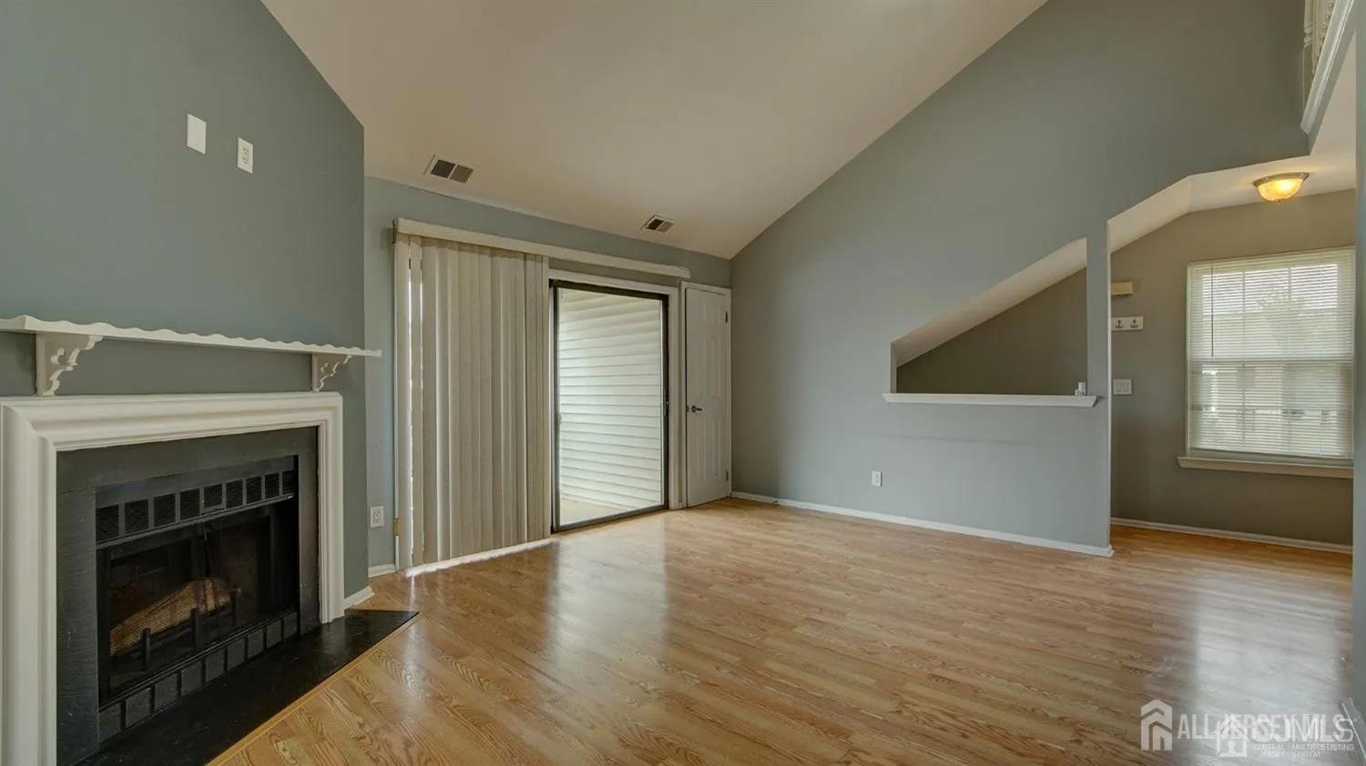 3003 Lighthouse Lane Parlin, NJ 08859 - Photo 6 of 25 a view of an empty room with window and fireplace