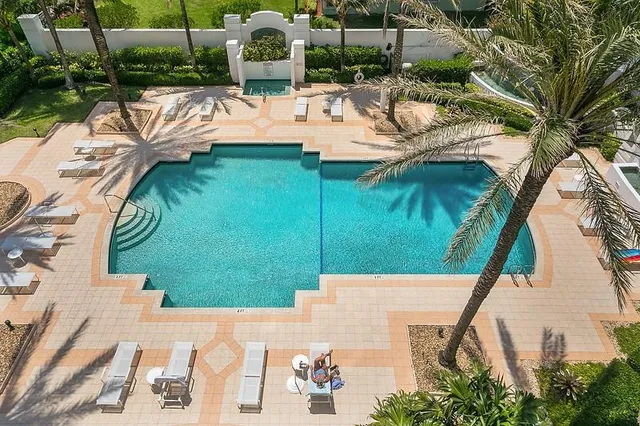 a view of a patio with swimming pool