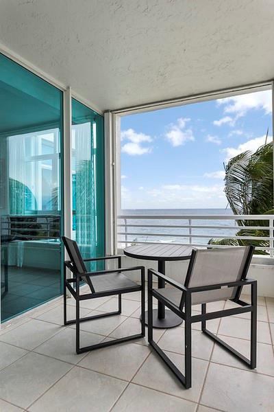 1700 South Ocean Boulevard, Unit 5B Lauderdale-by-the-Sea, FL 33062 - Photo 16 of 47 a view of a outdoor space with seating area