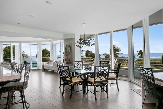 a kitchen with stainless steel appliances granite countertop a sink a stove and a wooden floors