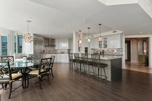 a kitchen with a sink a stove and cabinets