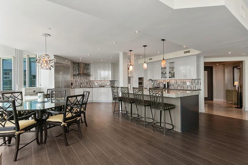 1700 South Ocean Boulevard, Unit 5B Lauderdale-by-the-Sea, FL 33062 - Photo 22 of 47 a view of a dining room with furniture wooden floor and a view of kitchen